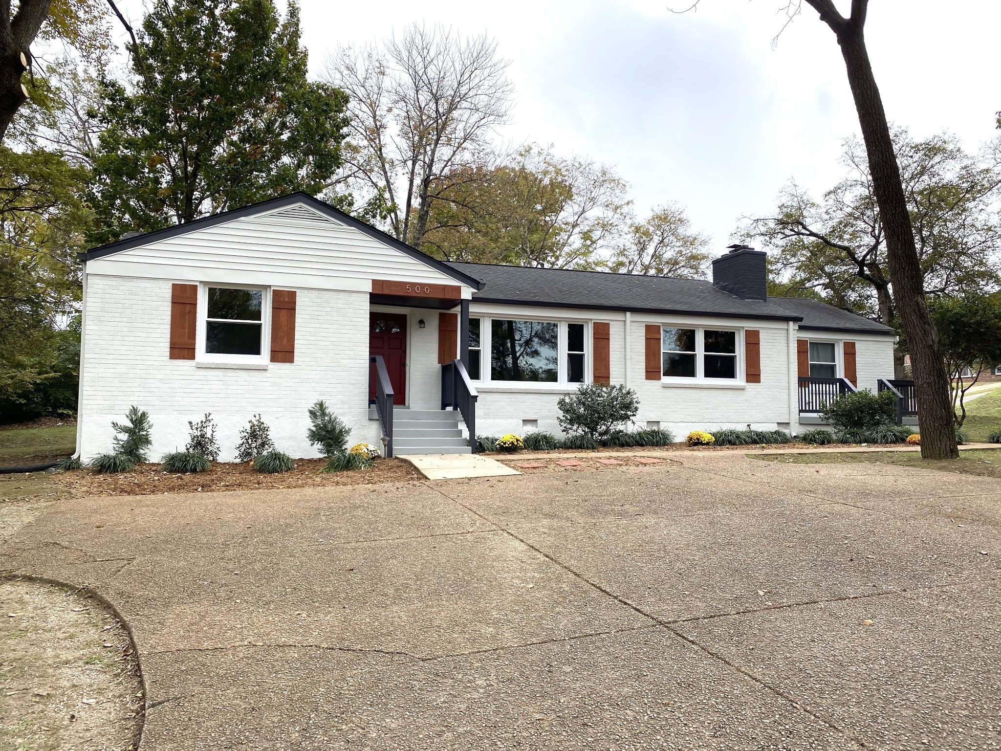 a front view of a house with a yard