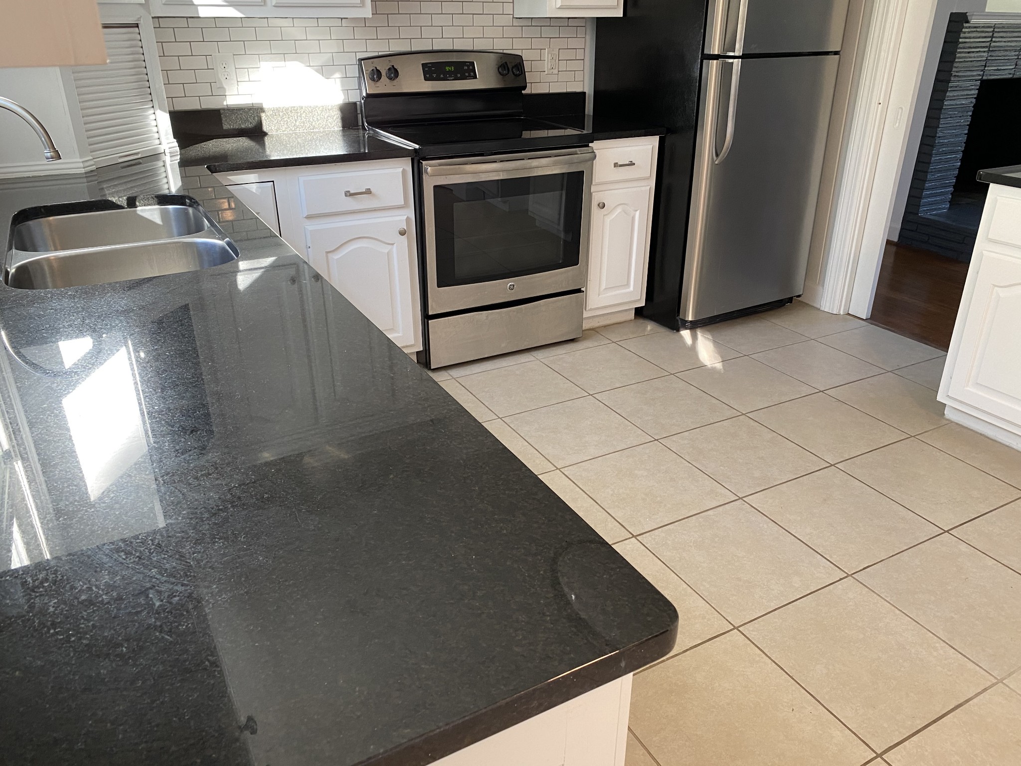 500 Vantrease Road Madison, TN 37115 - Photo 15 of 45 a kitchen with granite countertop a stove and a refrigerator