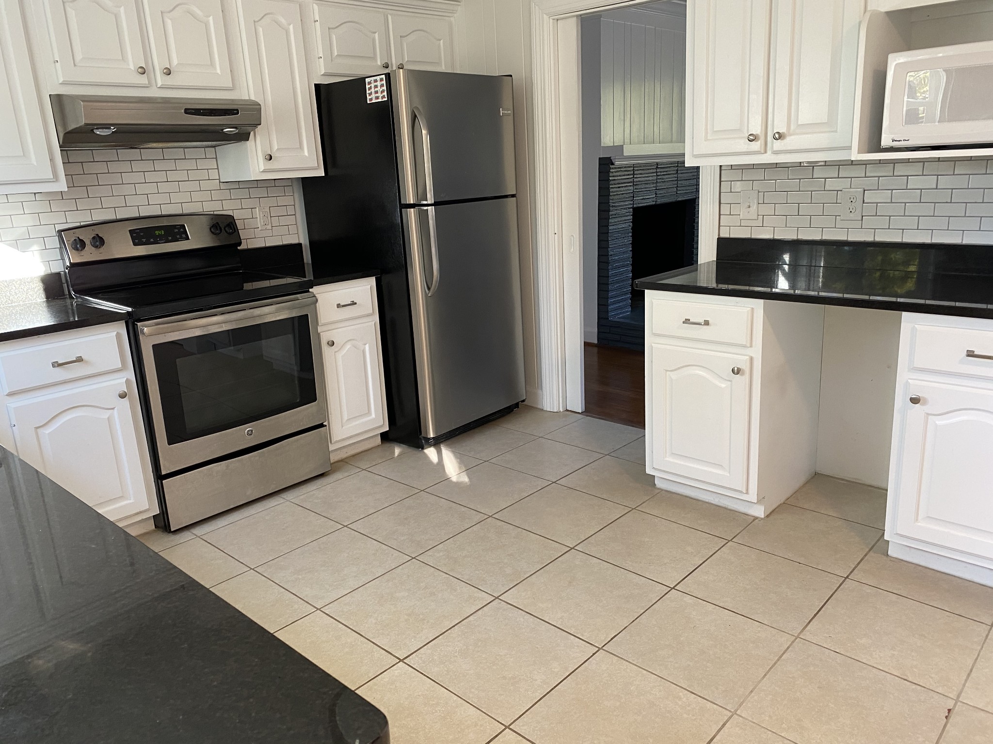 500 Vantrease Road Madison, TN 37115 - Photo 17 of 45 a kitchen with granite countertop a refrigerator stove and cabinets