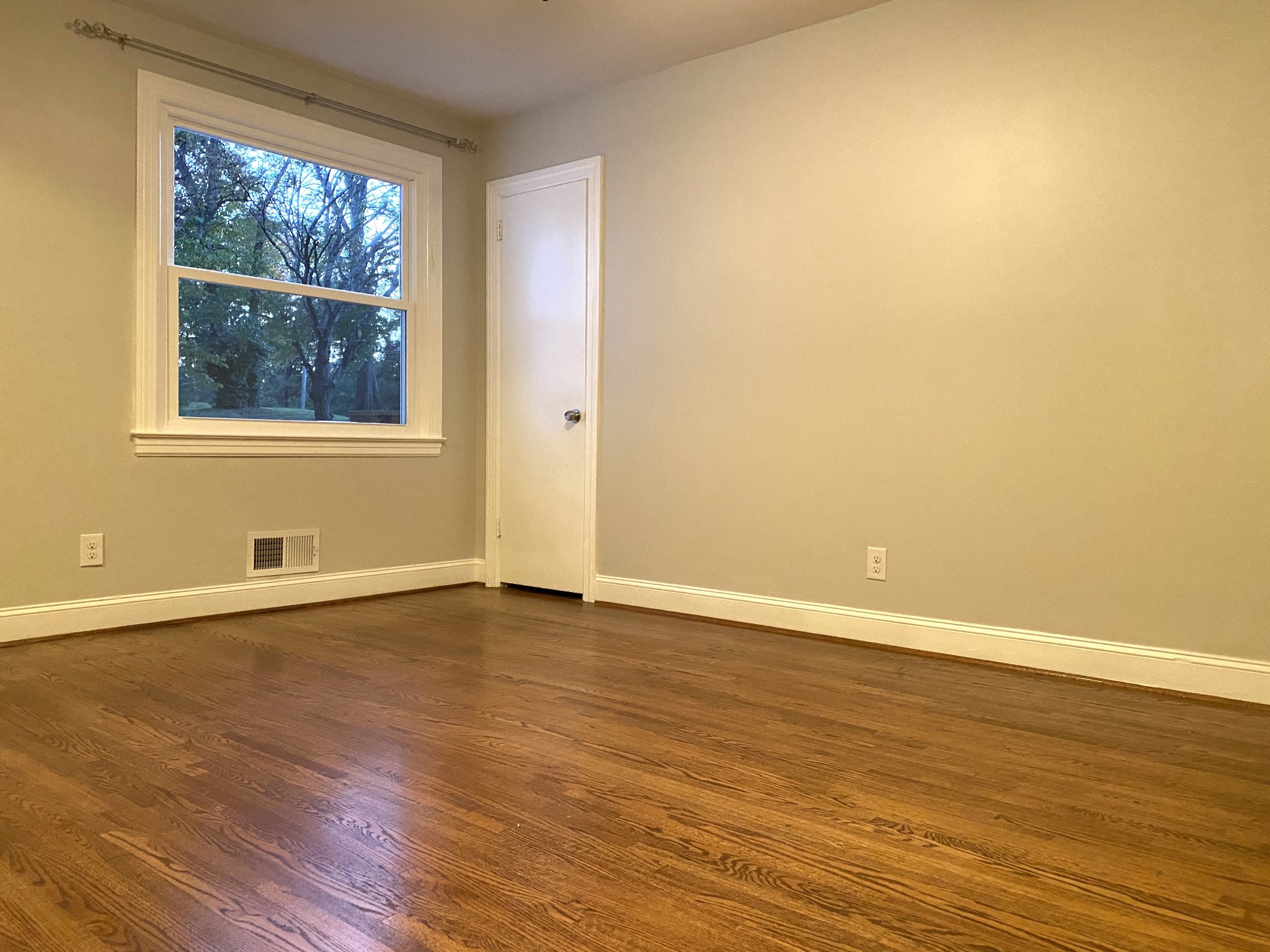 500 Vantrease Road Madison, TN 37115 - Photo 19 of 45 a view of an empty room with wooden floor and a window