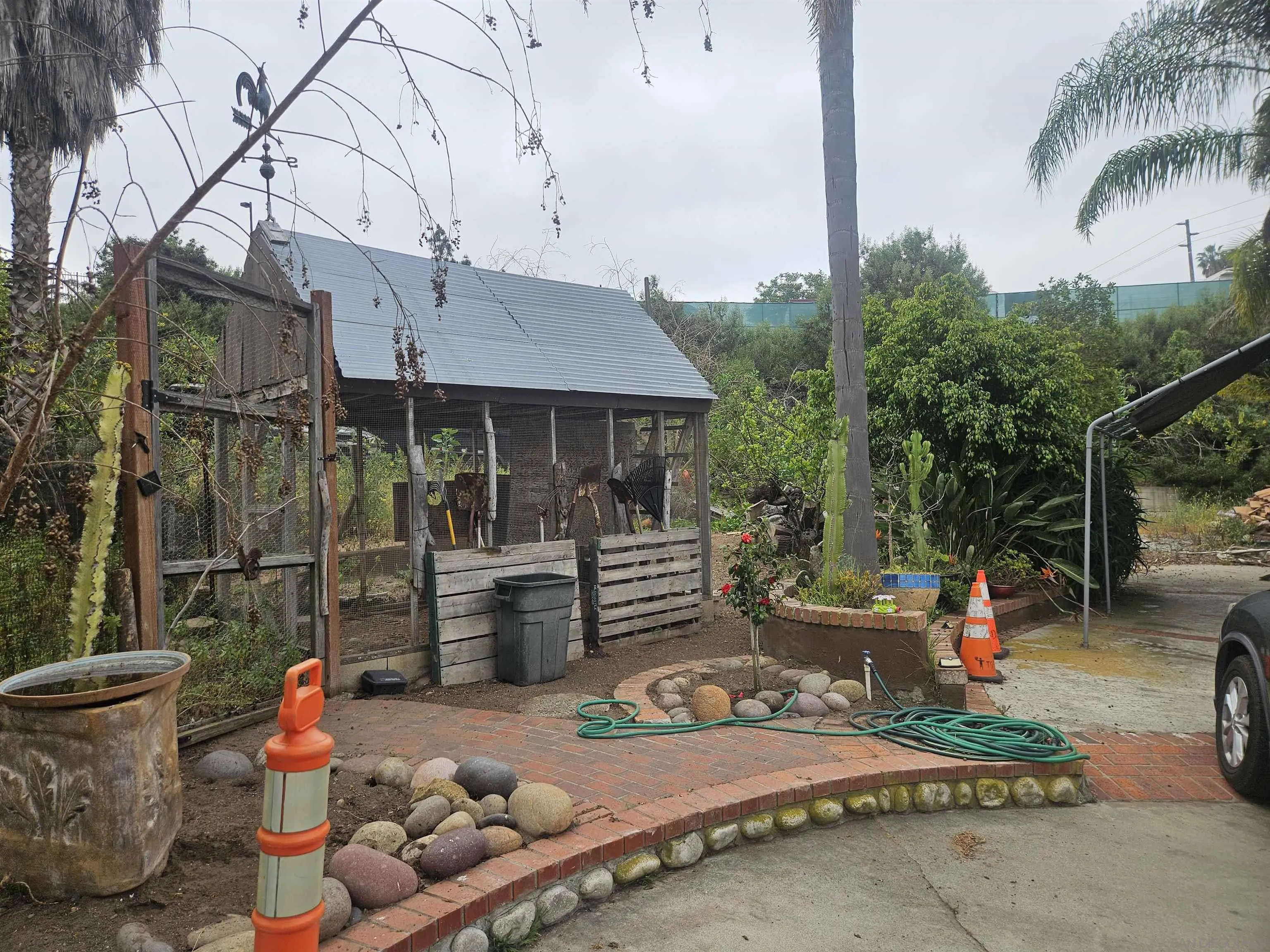 935 Encinitas Boulevard Encinitas, CA 92024 - Photo 12 of 20 a backyard of a house with fire pit and outdoor seating