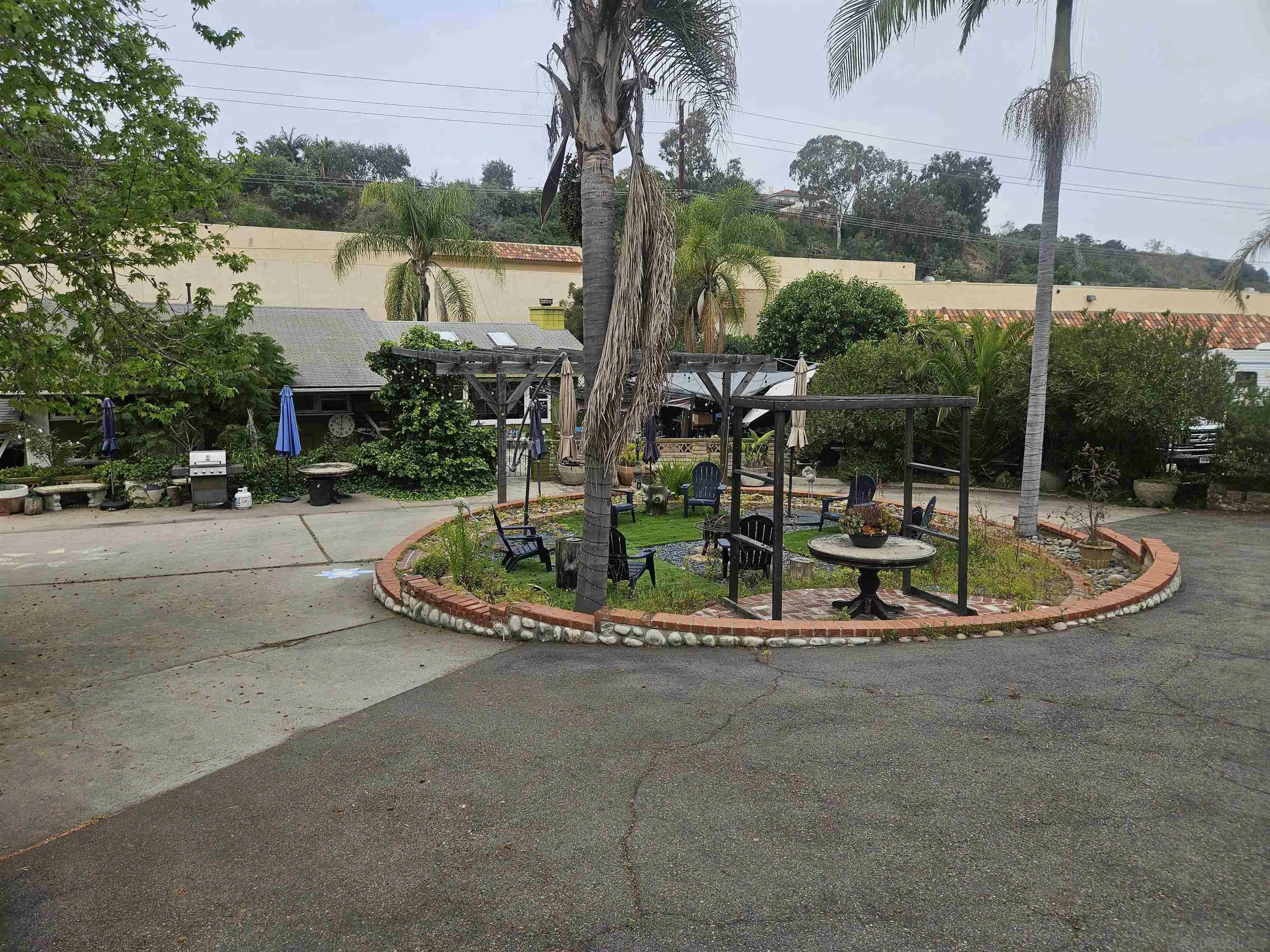 935 Encinitas Boulevard Encinitas, CA 92024 - Photo 4 of 20 a view of a house with a swimming pool and a yard
