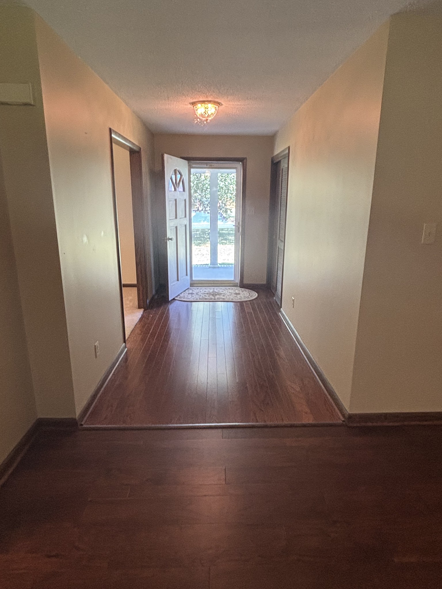 141 Doak Road Manchester, TN 37355 - Photo 3 of 41 an empty room with wooden floor and windows