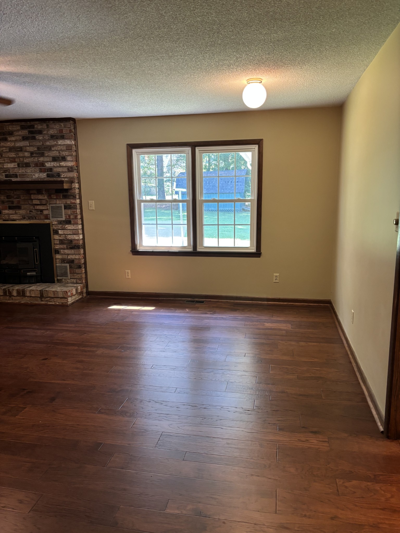 141 Doak Road Manchester, TN 37355 - Photo 7 of 41 an empty room with wooden floor and windows
