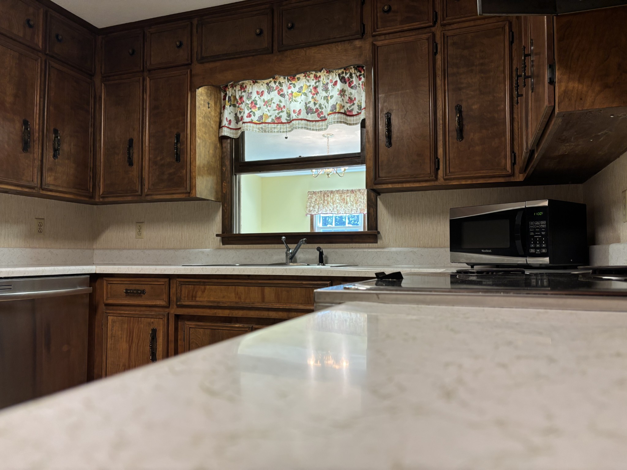 141 Doak Road Manchester, TN 37355 - Photo 9 of 41 a kitchen with stainless steel appliances a stove microwave and cabinets