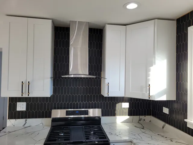a kitchen with a window and cabinets