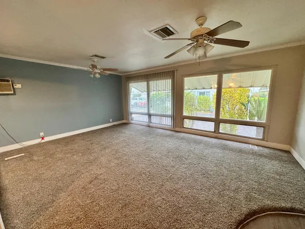 a view of an empty room with a window