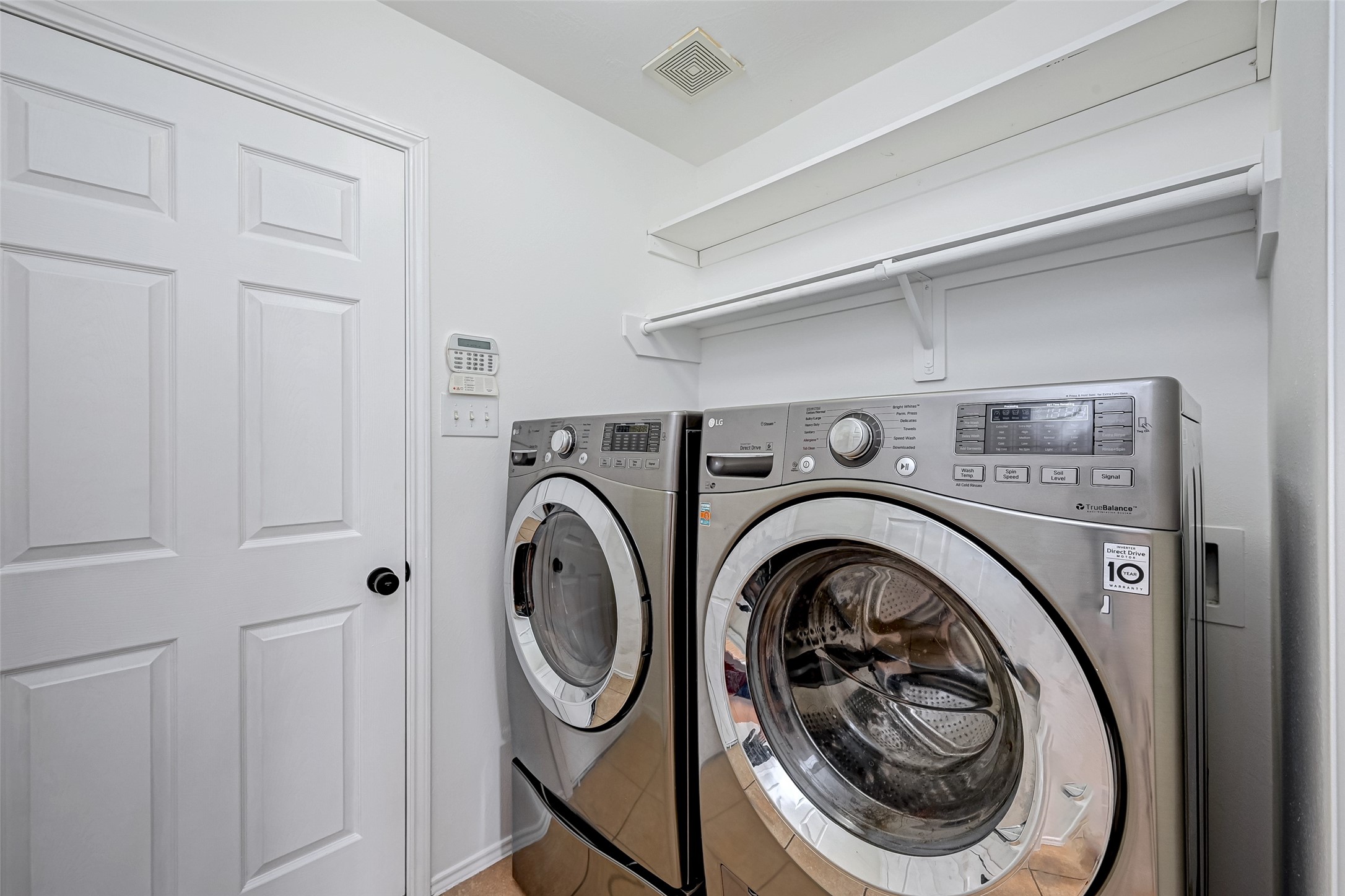 6906 Anson Point Lane Houston, TX 77040 - Photo 15 of 31 a utility room with dryer and washer
