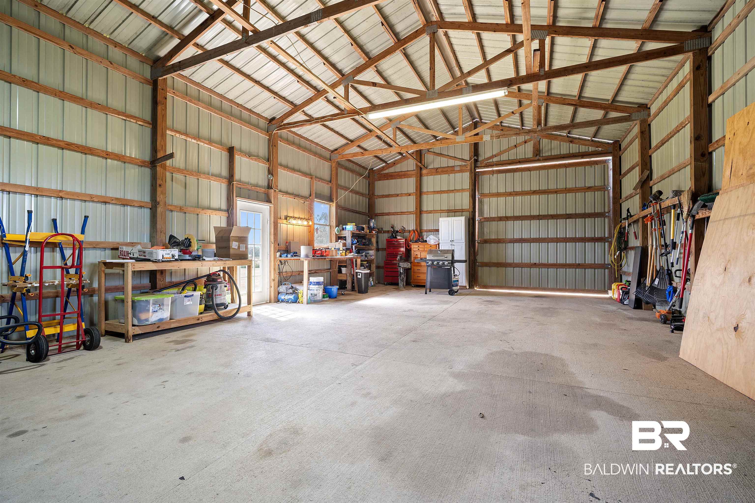22 Horace Odom Road Millry, AL 36558 - Photo 36 of 39 Garage with metal wall and a workshop area