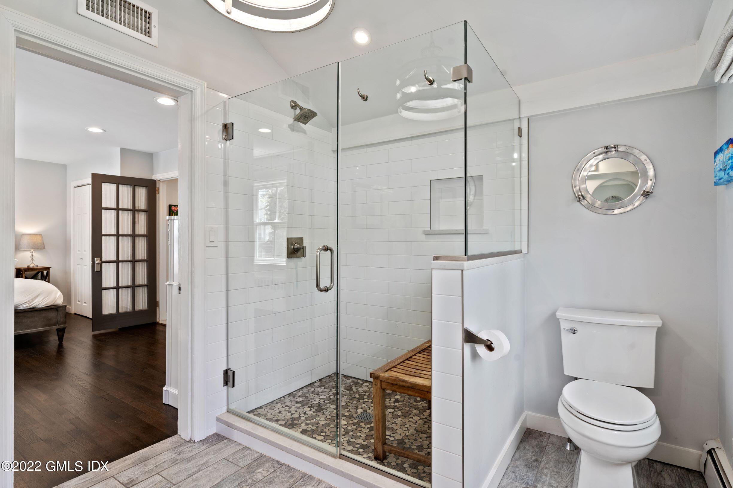 23 Manor Road Old Greenwich, CT 06870 - Photo 12 of 25 a bathroom with a shower a toilet and a sink