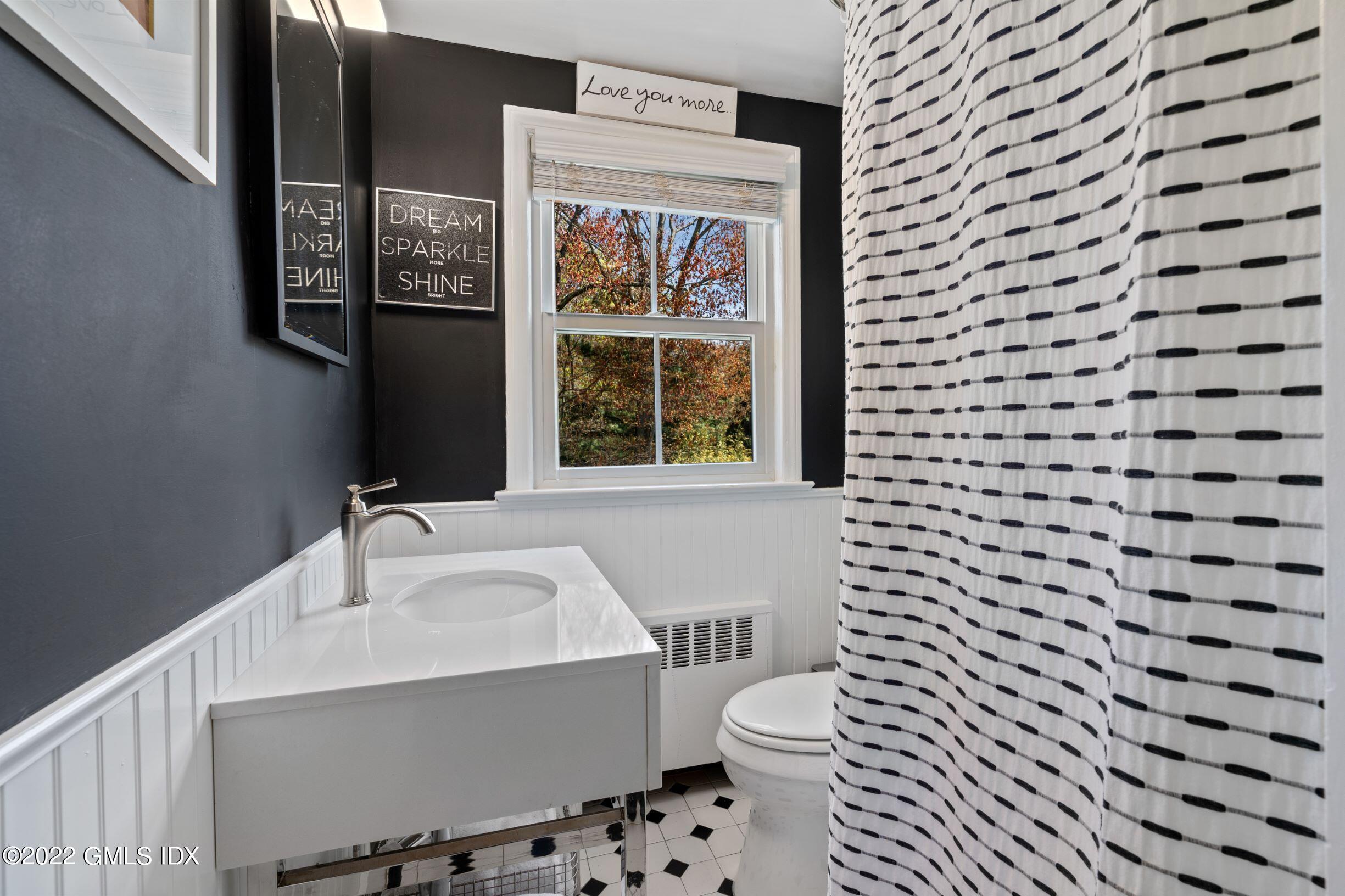 23 Manor Road Old Greenwich, CT 06870 - Photo 15 of 25 a bathroom with a sink and a toilet