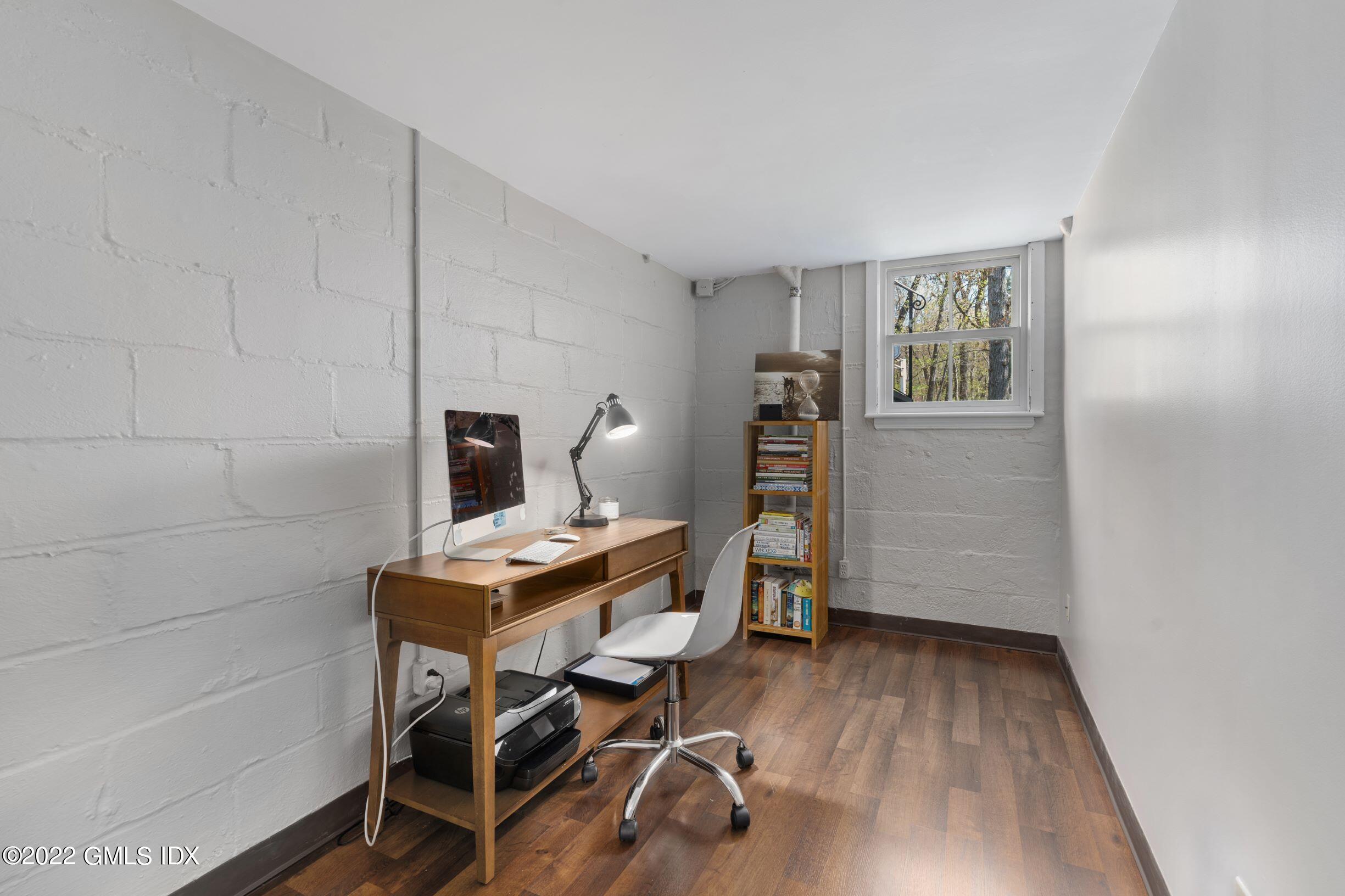 23 Manor Road Old Greenwich, CT 06870 - Photo 17 of 25 a view of a workspace with furniture and a window