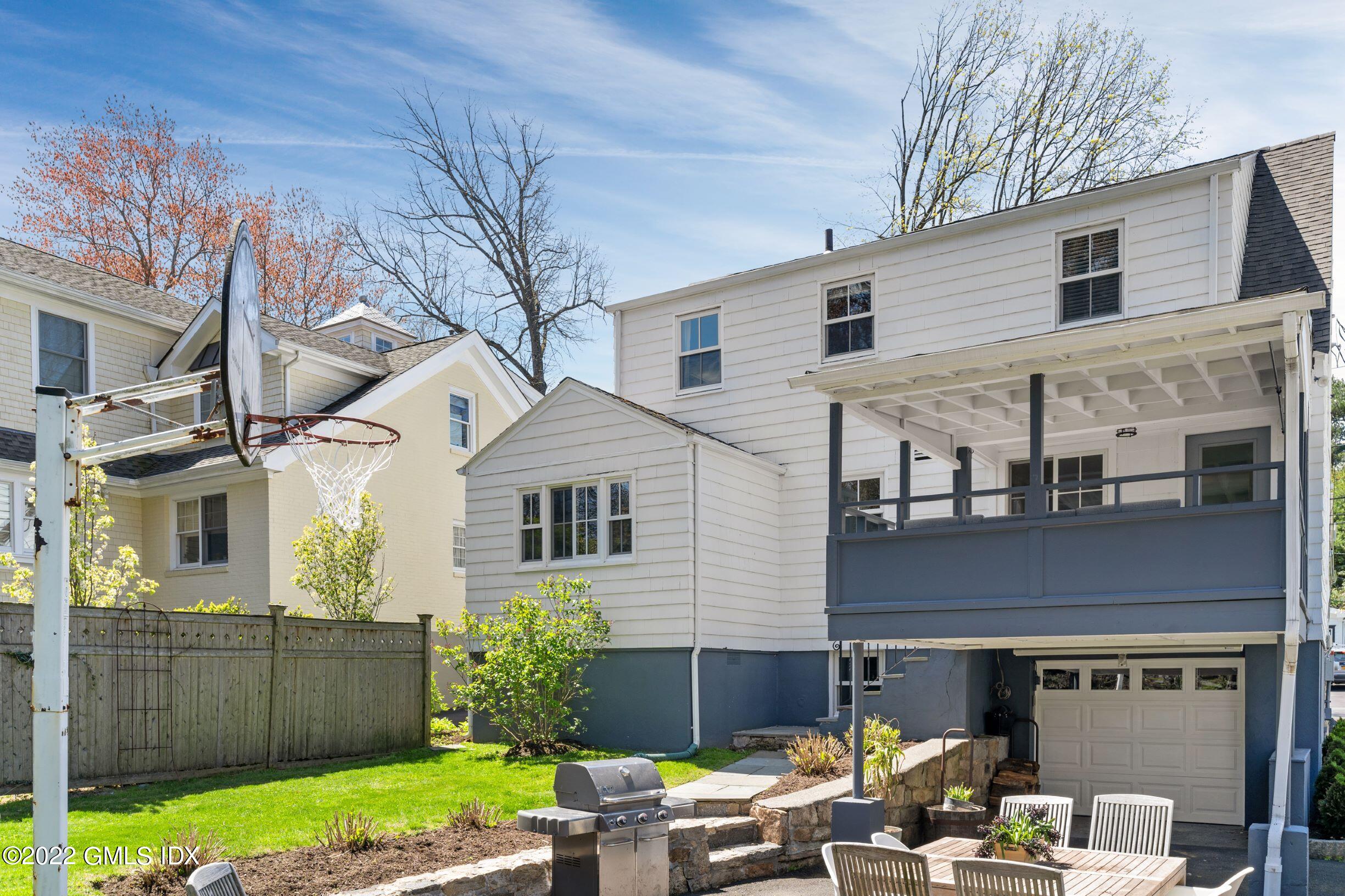 23 Manor Road Old Greenwich, CT 06870 - Photo 22 of 25 a front view of a house with garden