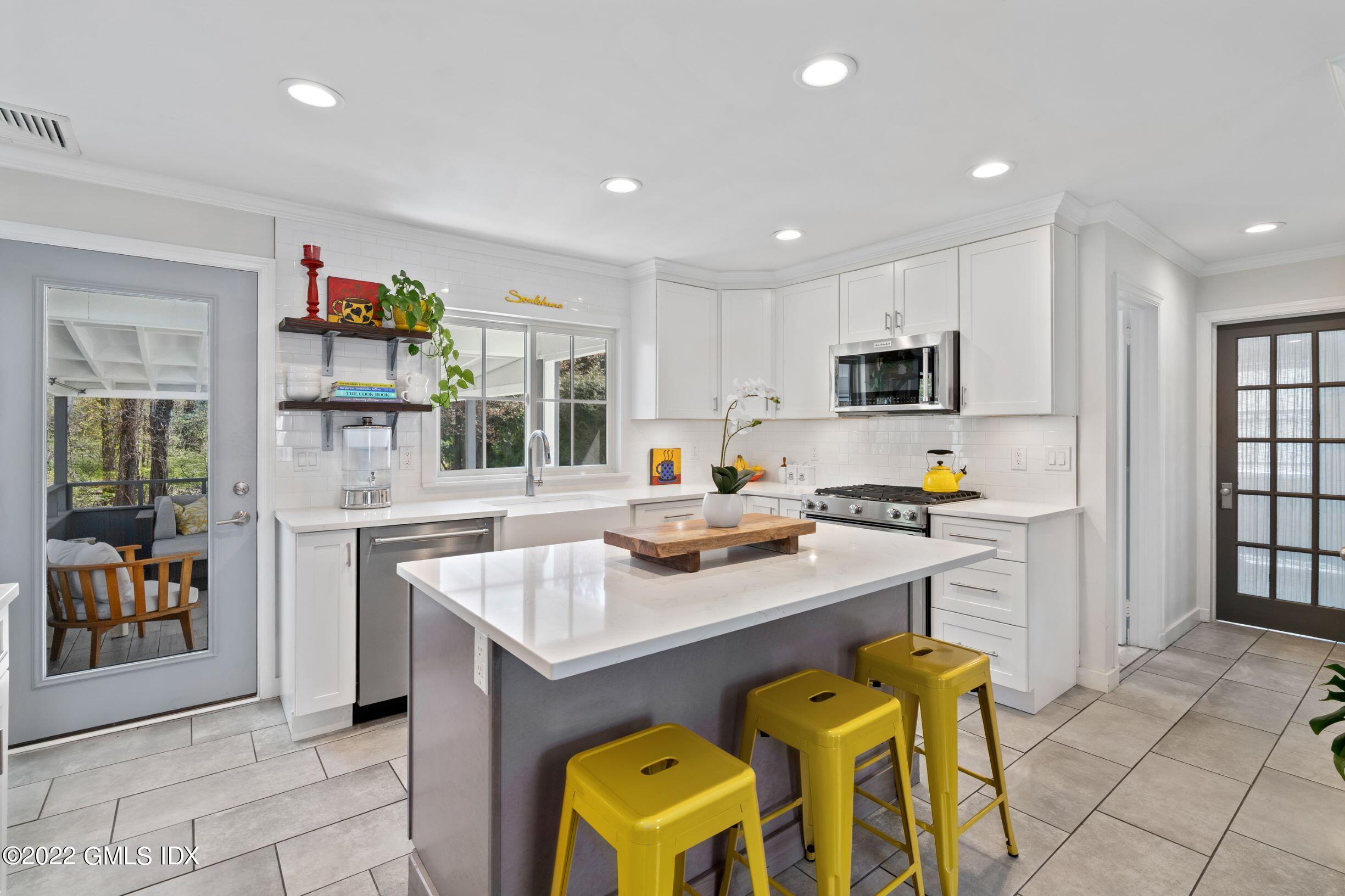 23 Manor Road Old Greenwich, CT 06870 - Photo 5 of 25 a kitchen with a sink cabinets and window