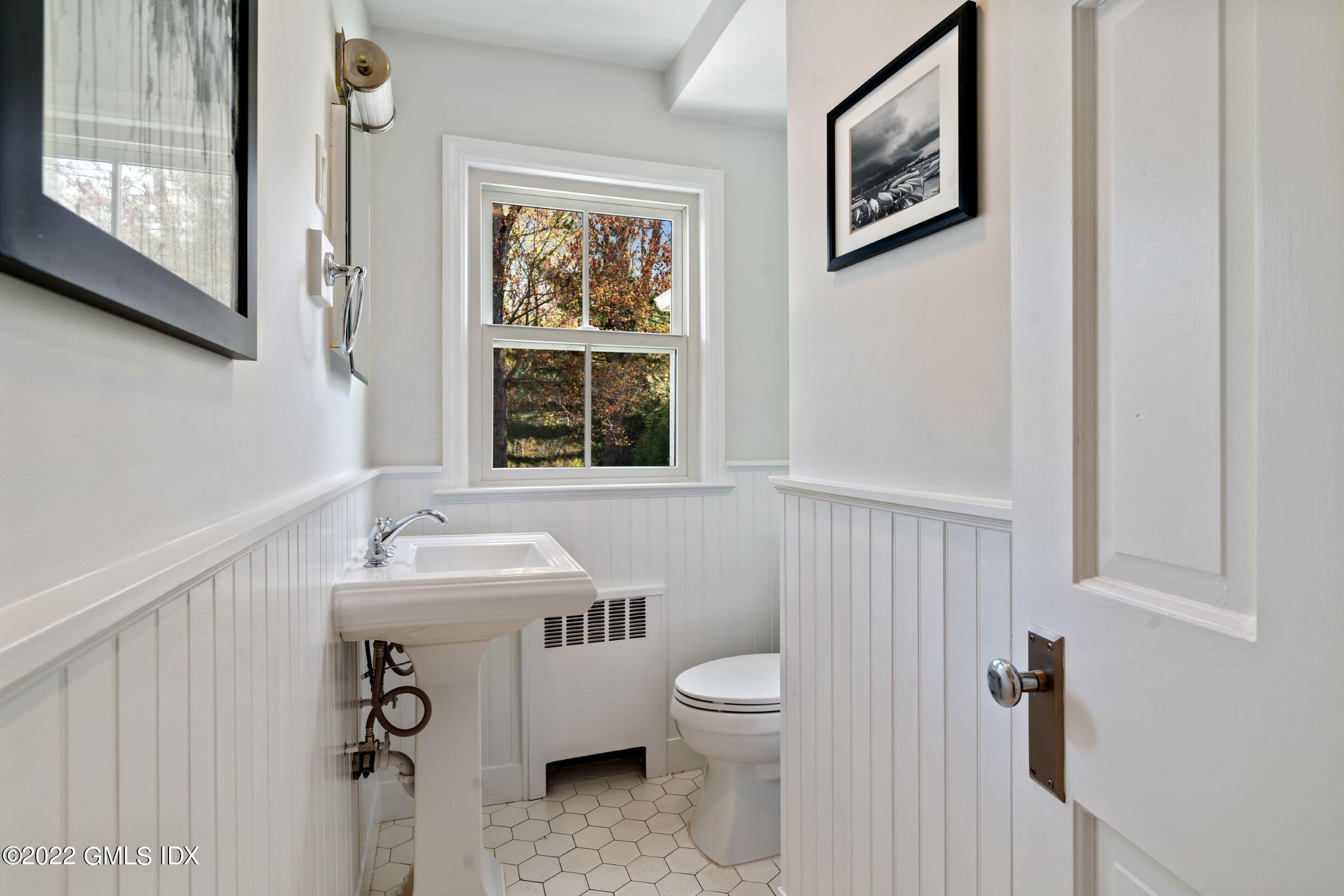 23 Manor Road Old Greenwich, CT 06870 - Photo 8 of 25 a bathroom with a sink toilet and shower