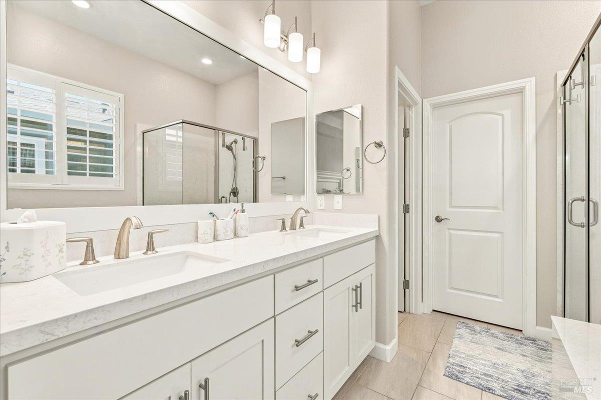 1604 Wildflower Way Rohnert Park, CA 94928 - Photo 18 of 36 Another view showing the double sinks, cabinetry and door to water closet.