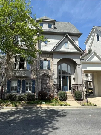 a view of a building with a yard