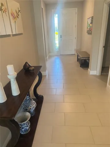 a living room with couches and a flat screen tv
