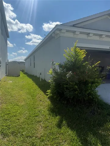 a view of a back yard of the house