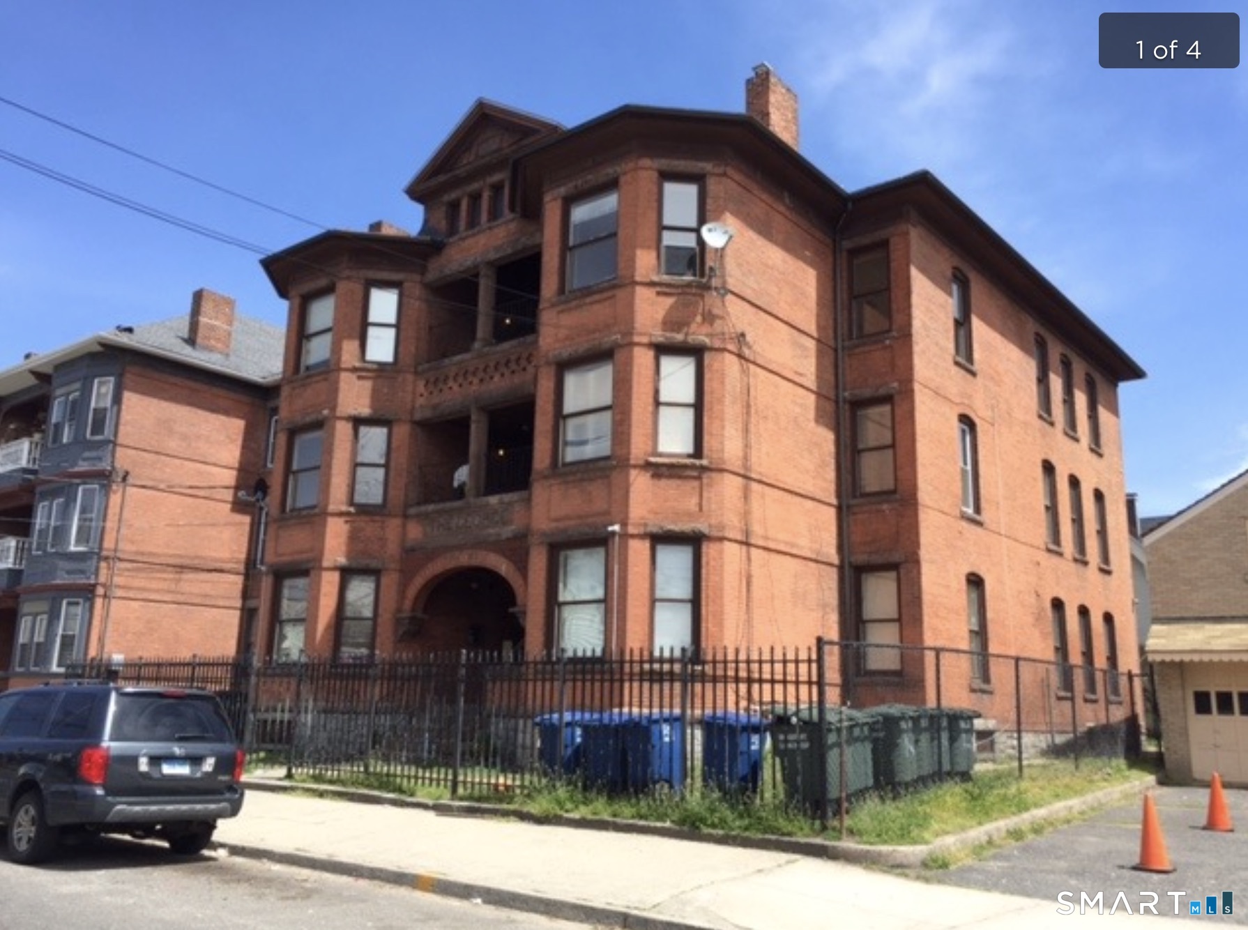 162 William Street, Unit 3R Bridgeport, CT 06608 - Photo 1 of 7 a car parked in front of a building