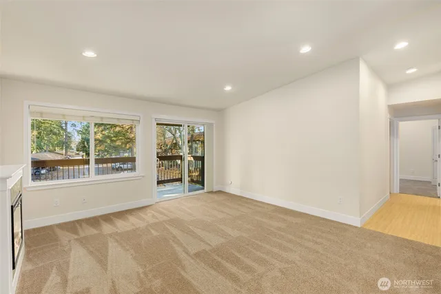 a view of an empty room with a window