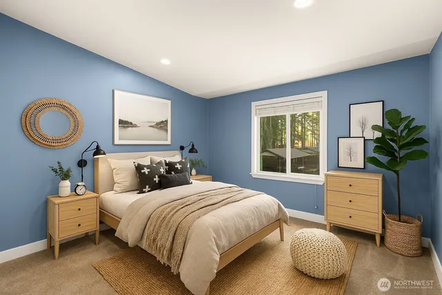 a bedroom with a bed and a dresser