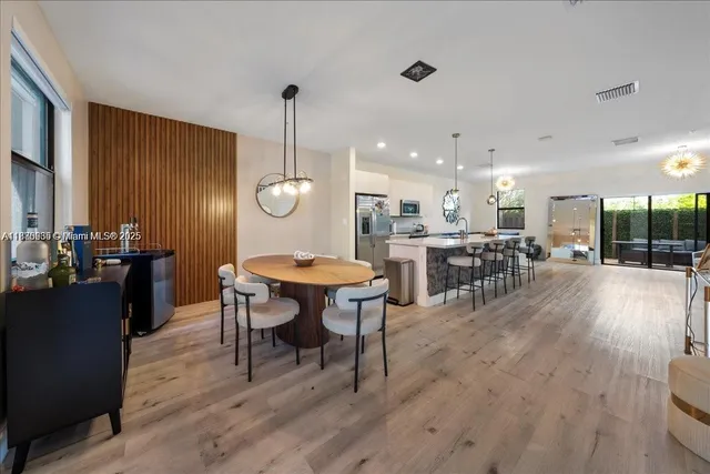 a kitchen with a table and chairs