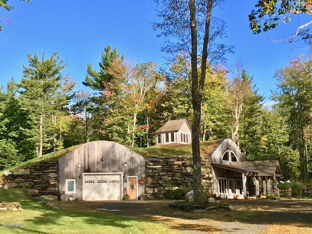 49 Forget Road Hawley, MA 01339 - Photo 1 of 30 a front view of a house with a garden