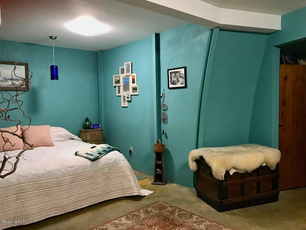49 Forget Road Hawley, MA 01339 - Photo 18 of 30 a bedroom with a bed and a mirror