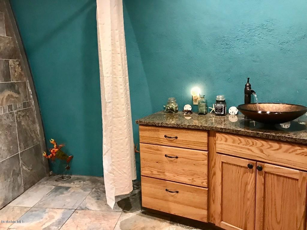 49 Forget Road Hawley, MA 01339 - Photo 21 of 30 a bathroom with a sink and a mirror