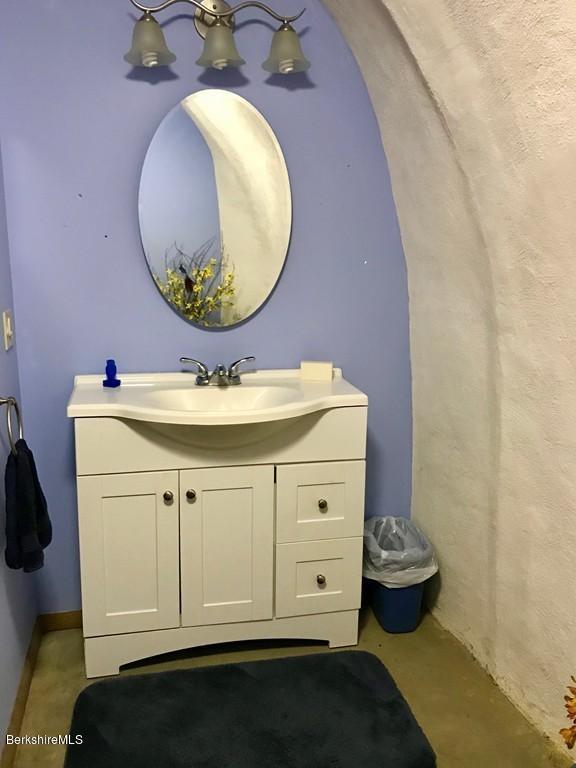 49 Forget Road Hawley, MA 01339 - Photo 24 of 30 a bathroom with a sink mirror and toilet