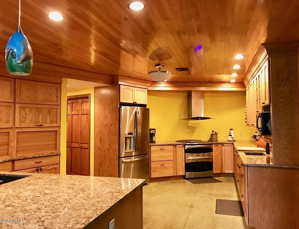 49 Forget Road Hawley, MA 01339 - Photo 7 of 30 a kitchen with cabinets and stainless steel appliances