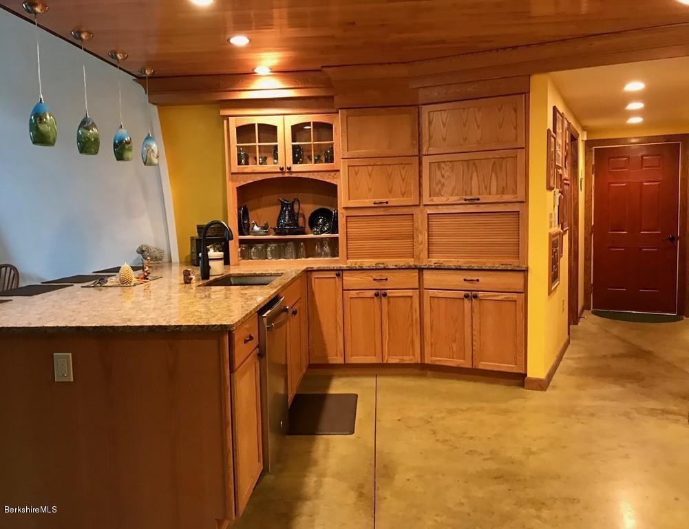 49 Forget Road Hawley, MA 01339 - Photo 8 of 30 a kitchen with kitchen island a sink appliances and cabinets