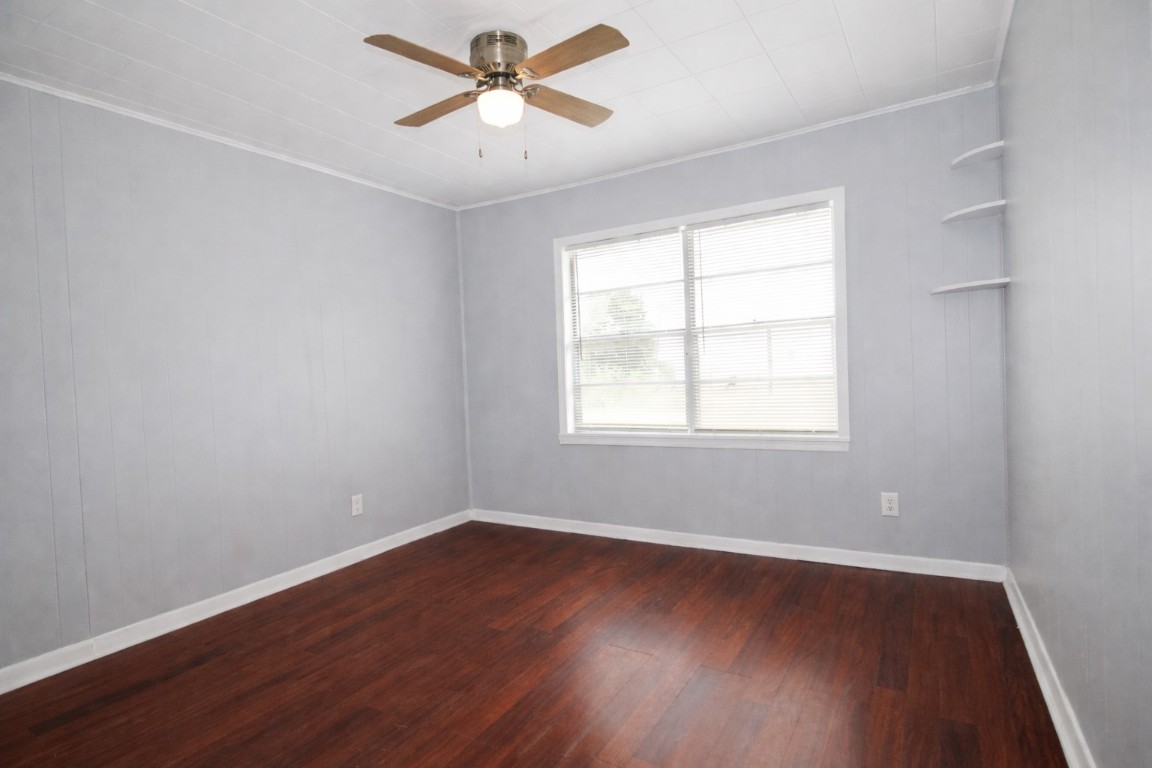 2727 Nelga Road, Unit C Wharton, TX 77488 - Photo 5 of 11 a view of empty room with wooden floor and fan