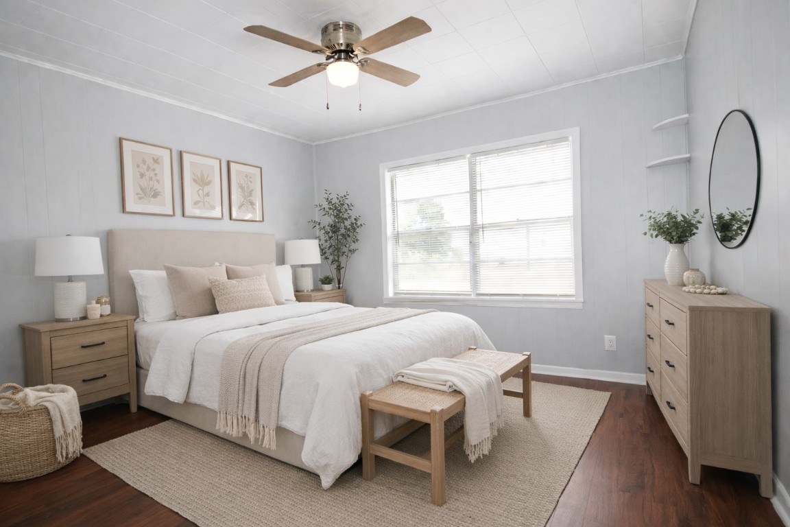 2727 Nelga Road, Unit C Wharton, TX 77488 - Photo 6 of 11 a bedroom with a bed and a chandelier