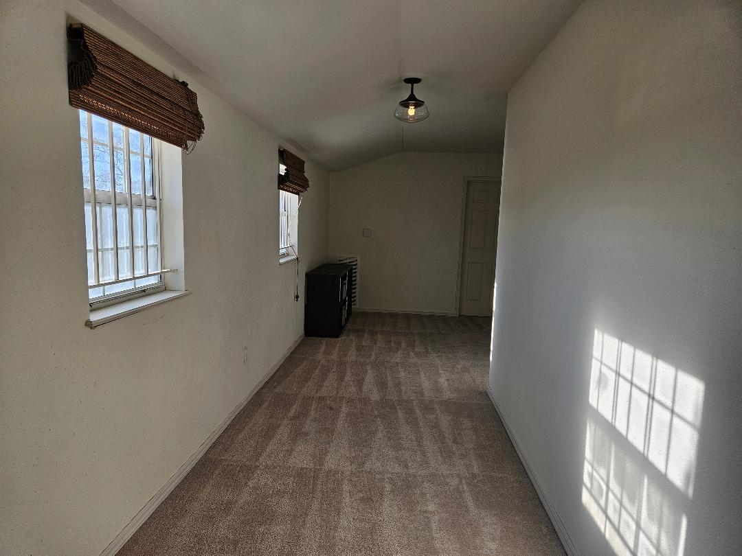 710 North Avenue C Elgin, TX 78621 - Photo 21 of 33 a view of empty room with windows