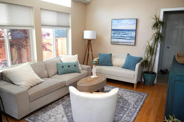 a living room with furniture and a rug