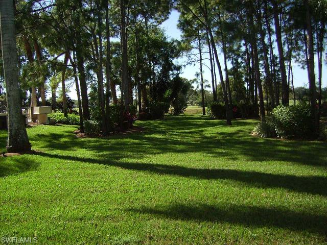 265 Deerwood Circle, Unit 3 Naples, FL 34113 - Photo 12 of 14 a view of a golf course