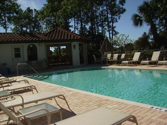 265 Deerwood Circle, Unit 3 Naples, FL 34113 - Photo 13 of 14 a view of a house with backyard porch and sitting area