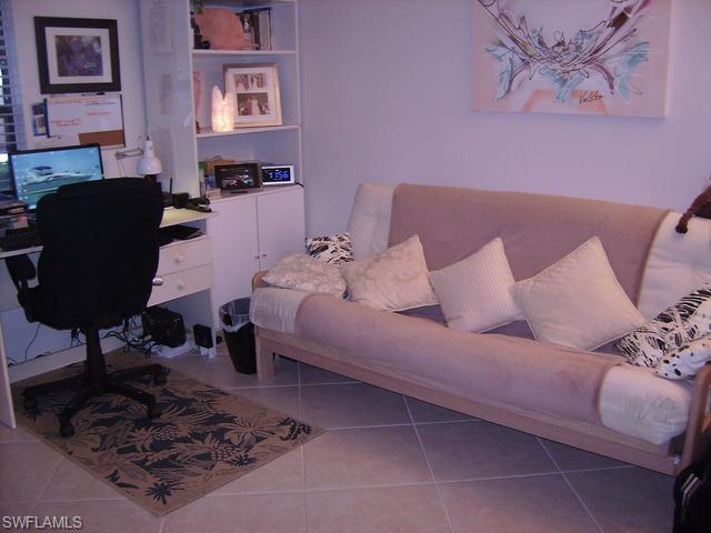 265 Deerwood Circle, Unit 3 Naples, FL 34113 - Photo 8 of 14 a living room with furniture
