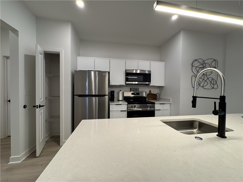 103 Erie Rdg Drive Henrietta, NY 14467 - Photo 5 of 14 Typical kitchen with stainless steel appliances, b