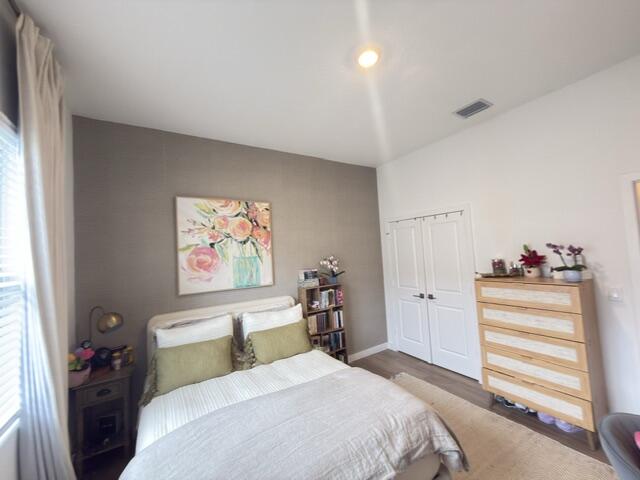 19696 Weathervane Way Loxahatchee, FL 33470 - Photo 21 of 39 a bedroom with a bed and a window
