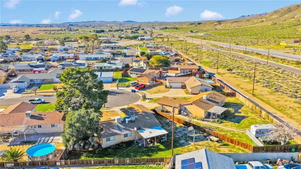 an aerial view of a house with a swimming pool