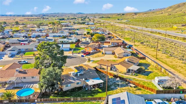 an aerial view of a house with a swimming pool