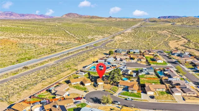 a view of a house with snow on the ground