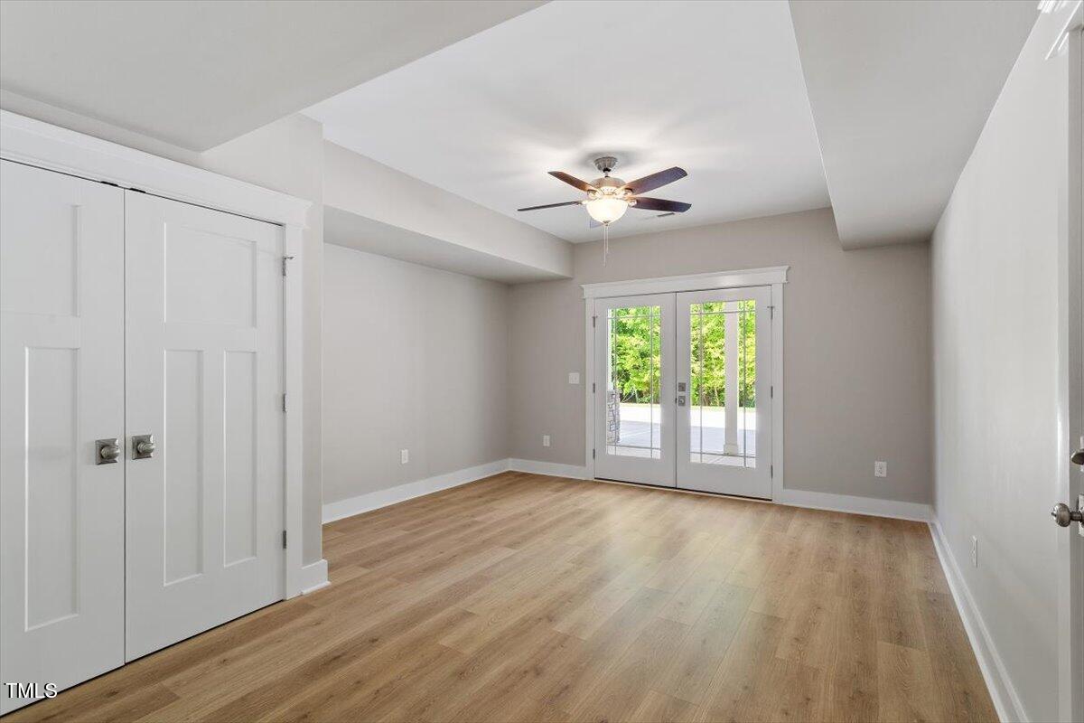 3932 Old Chapel Hill Road Durham, NC 27707 - Photo 40 of 46 a view of an empty room with a window and wooden floor