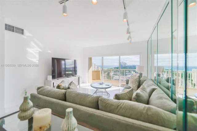 a living room with furniture and a large window