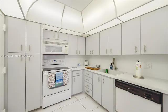 a kitchen with stainless steel appliances cabinets and a refrigerator