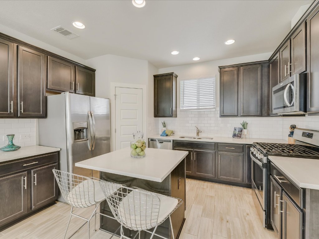 1916 Warely Lane Austin, TX 78741 - Photo 11 of 15 a kitchen with a sink stove and refrigerator