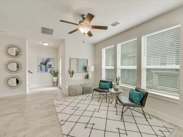 a large kitchen with a table and chairs